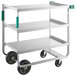 A Regency three-shelf stainless steel cart with black wheels.