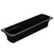 A black Cambro rectangular plastic food pan with a lid on a counter.