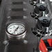 The gas gauge and dial on a Crown Verity Club Series liquid propane outdoor pizza oven.