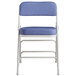 A blue folding chair with a white frame.