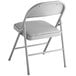 A Lancaster Table & Seating folding chair with a gray cushion.