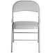 A gray Lancaster Table & Seating folding chair with a padded seat.