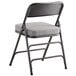 A Lancaster Table & Seating grey fabric folding chair with a 2" padded seat.