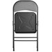 A black folding chair with a grey padded seat.