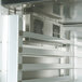 A Traulsen stainless steel heated holding cabinet with shelves and doors.