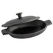 A black cast iron oval casserole dish with a lid.