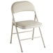 A beige folding chair with a padded seat.