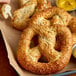 A close-up of J & J Snack Foods Jalapeno Pepperjack Cheese Stuffed Soft Pretzels on a tray.
