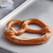 A J & J Snack Foods Bavarian soft pretzel on a tray.