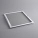 A white square glass lid with a white handle.