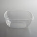 A clear Fineline rectangular plastic bowl with a clear lid.