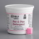 A white tub of 90 Noble Chemical QuikPacks with pink detergent in it.