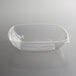 A clear Fineline PET plastic bowl with a lid on a table.