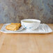 A Blue Bamboo melamine tray with a bowl of soup and egg rolls.