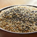 A bowl of black and white Regal Everything Bagel Seasoning seeds.