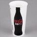 A white Solo paper cold cup with a black Coca Cola bottle on it.