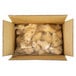 A white box filled with plastic bags of Brakebush Honey Touched Fully Cooked Battered Chicken Wing Drummettes.