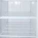 A white Avantco metal grid shelf for a refrigerator.