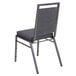 A Flash Furniture dark grey fabric banquet chair with a metal frame and back.