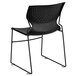 A Flash Furniture black plastic stack chair with metal legs.