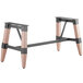 A Lancaster Table & Seating rustic industrial wooden trestle table base with metal legs.