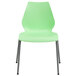 A green plastic chair with metal legs.