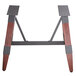A Lancaster Table & Seating wooden trestle table base with metal legs.