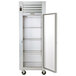 A white Traulsen G Series reach-in refrigerator with a right-hinged glass door open.