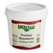 A white bucket with a label reading "Lucky Leaf Premium Strawberry Fruit Filling & Topping"