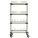 A MetroMax 4 mobile four tier rack with white shelves and blue poles on wheels.