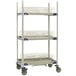 A MetroMax metal mobile three tier drying rack with trays on it.