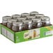 A box of twelve Ball wide mouth glass canning jars with silver metal lids.