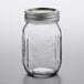 A Ball glass canning jar with a silver metal lid.
