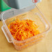AvaMix 5/64" Julienne Disc in a food processor filled with shredded carrots.