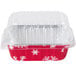 A red and white Durable Packaging foil bread loaf pan with a clear lid decorated with snowflakes.