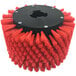 A red and black circular MotorScrubber stair and baseboard brush with red bristles.