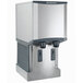 A white Scotsman wall mount ice machine and water dispenser with two water dispensers.