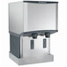 A white Scotsman wall mount ice machine and water dispenser with two doors.
