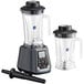 Two AvaMix commercial blenders with Tritan containers on a table in a professional kitchen.