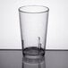 A close-up of a clear Cambro plastic tumbler with a crackled surface.