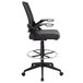 A Boss black mesh drafting stool with black armrests.