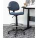 A blue Boss drafting chair with a metal base and foot ring.