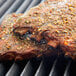 Regal Savory Grill Seasoning on ribs cooking on a grill.
