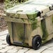 A green and black CaterGator outdoor cooler with wheels.