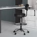 A black Boss drafting stool with a round metal ring.