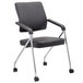 A black Boss office chair with chrome wheels.