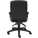 A black Boss office chair with adjustable arms and a backrest.