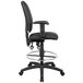 A Boss black drafting stool with a black seat and back on a chrome base.
