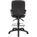 A Boss black drafting stool with adjustable arms.