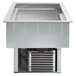 A Vollrath drop-in refrigerated cold food well with two pans in a stainless steel counter.